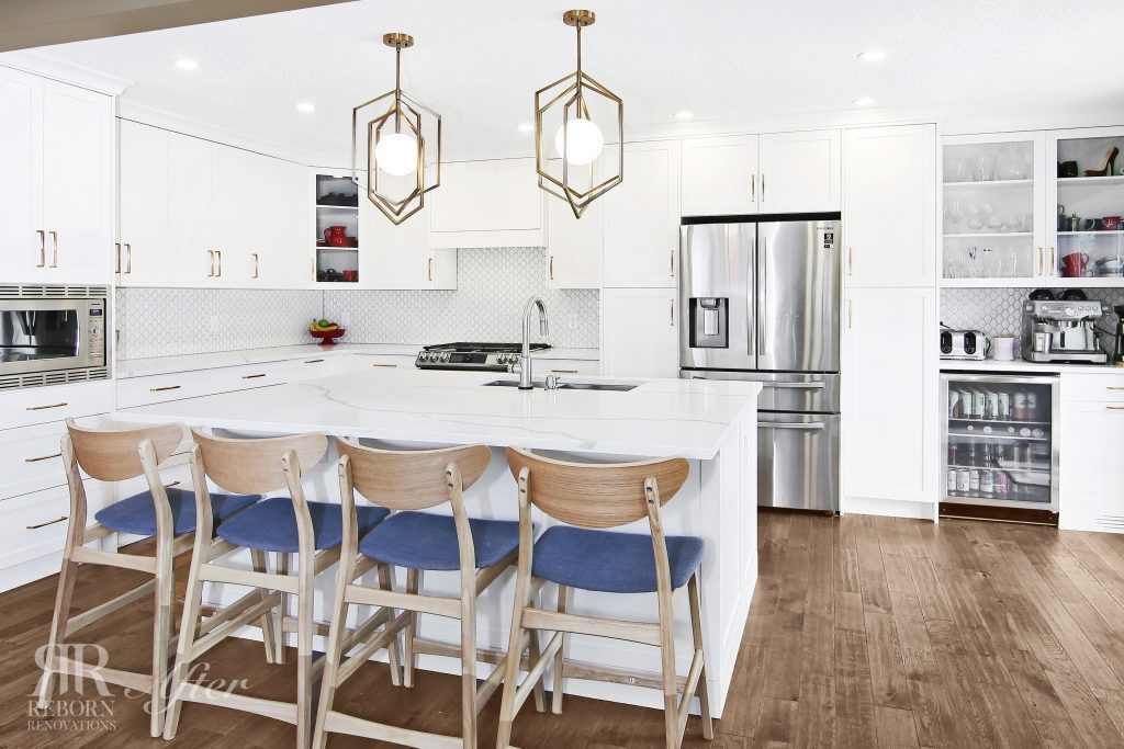 photos of newly renovated kitchen, hardwood flooring, modern appliances, white accent of custom cabinet and countertops, iron cage chandelier in Evanston Calgary, AB