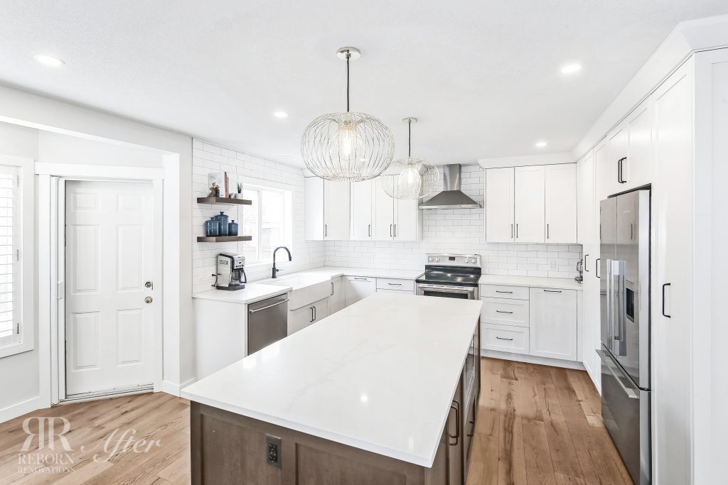 Photos of newly renovated kitchen, wooden flooring, white wooden cabinets with marble countertops, modern design of kitchen cabinets, modern appliances in Calgary AB, CA