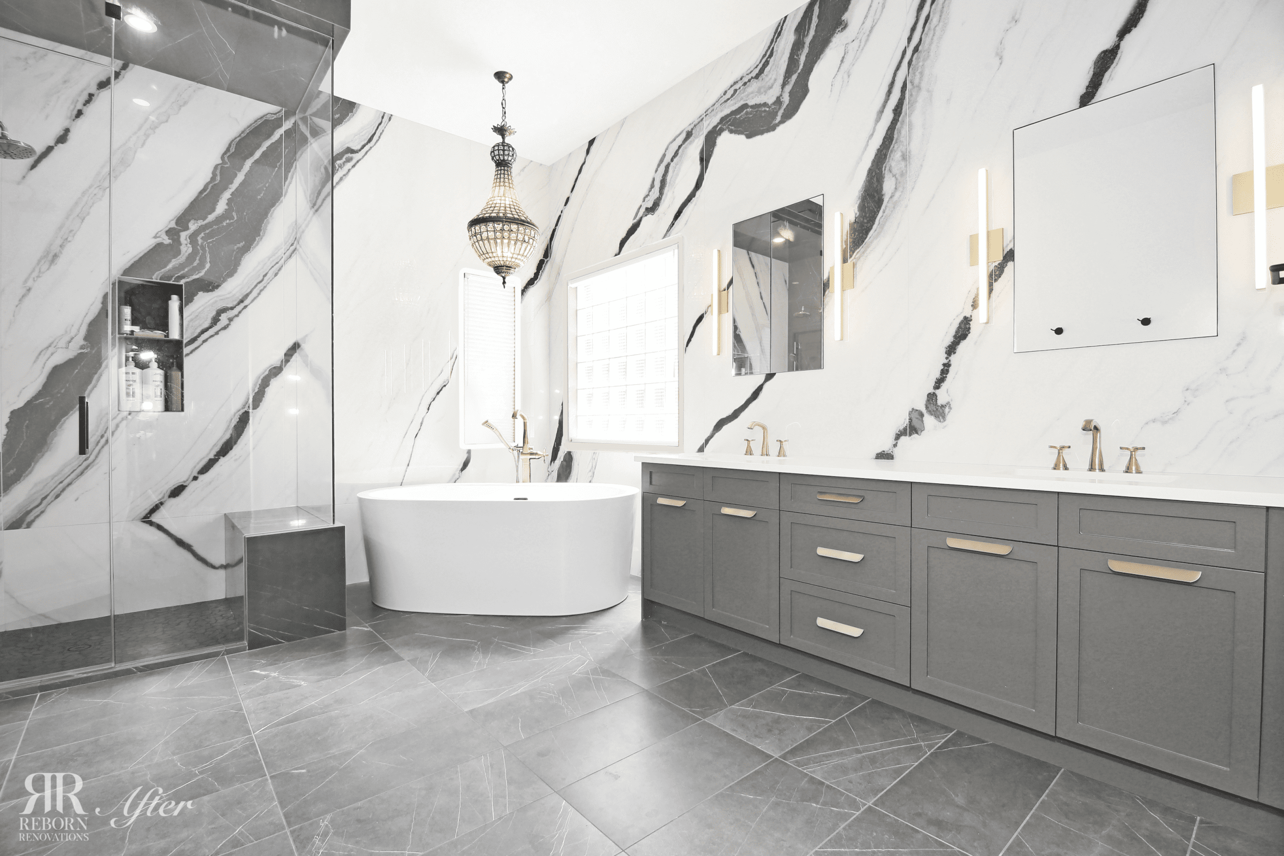 A modern bathroom with marble walls and a tub, providing tips to modernize an older home.