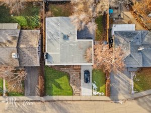 An aerial view of a house with a car parked in front of it undergoing an Exterior Remodel in Wildwood.